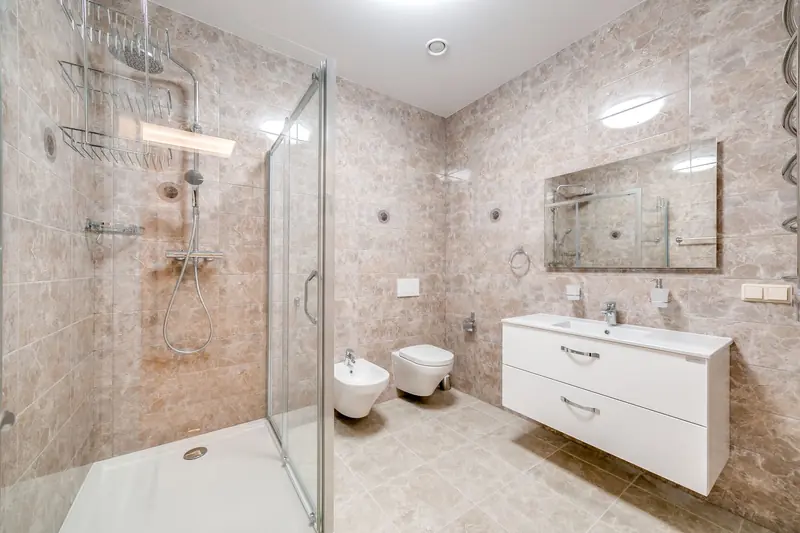 Contemporary bathroom featuring a glass shower and sleek fixtures in a minimalist design